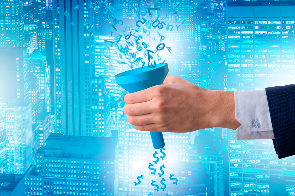 sullo sfondo palazzi, in primo piano, mano che tiene un imbuto dove entrano numeri e escono $