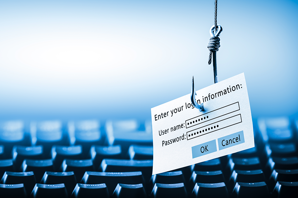 tastiera con sopra un amo per pescare i pesci e attaccato un foglietto con user name e password