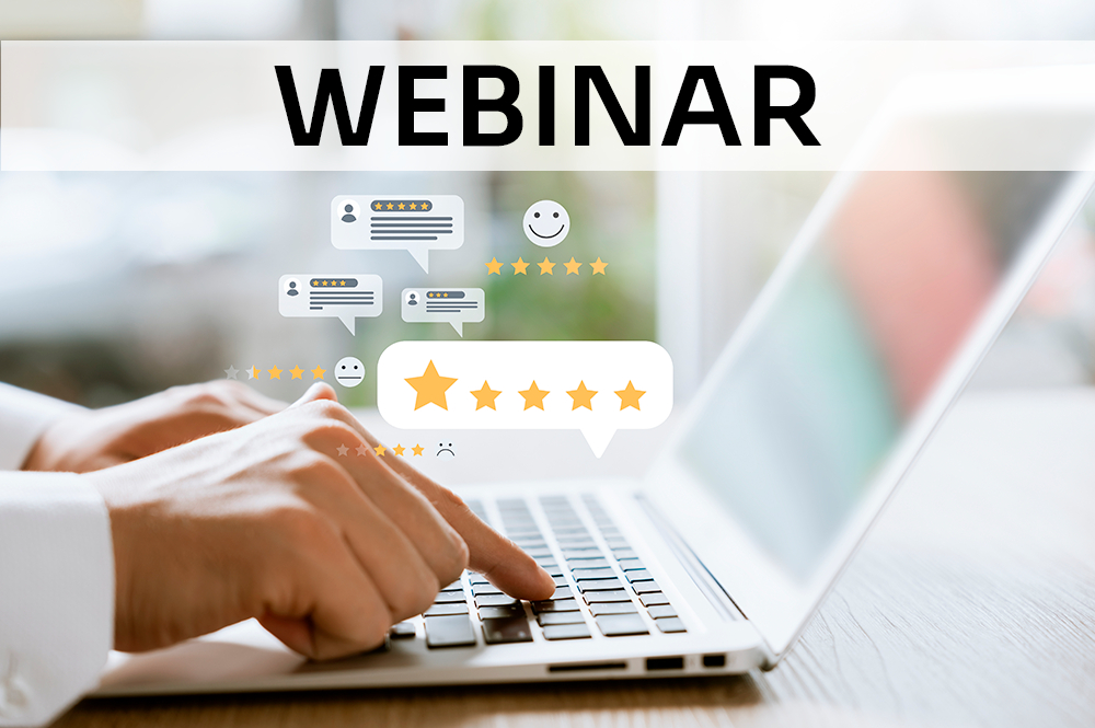 mani che scrivono un un pc con sopra dei fumetti e sopra la scritta Webinar